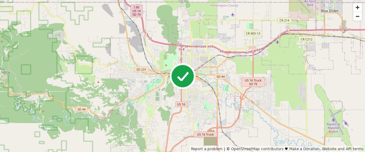 Street map of Rapid City, Pennington County, South Dakota, with a green check mark pinning the center of Rapid City Compost's commercial pickup service area.